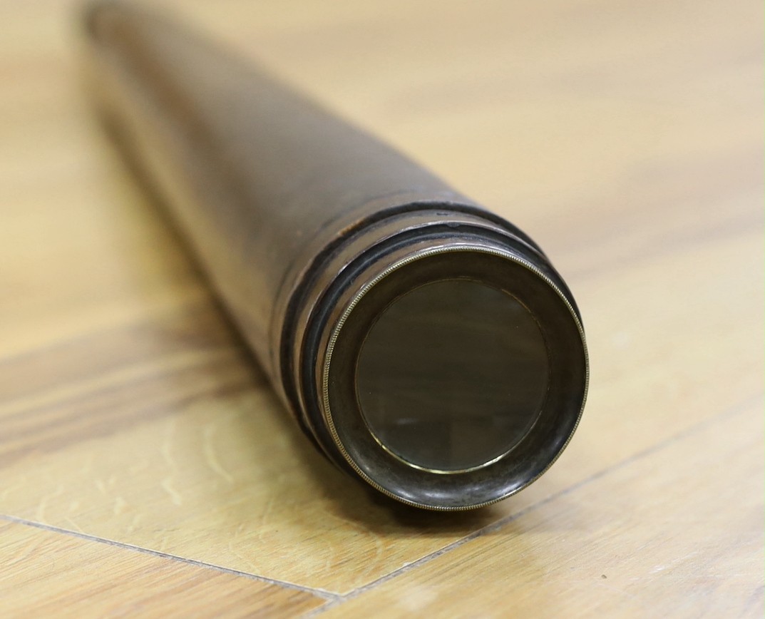 A single draw brass and leather Watkins & Hill telescope, total extended length 74.5cm